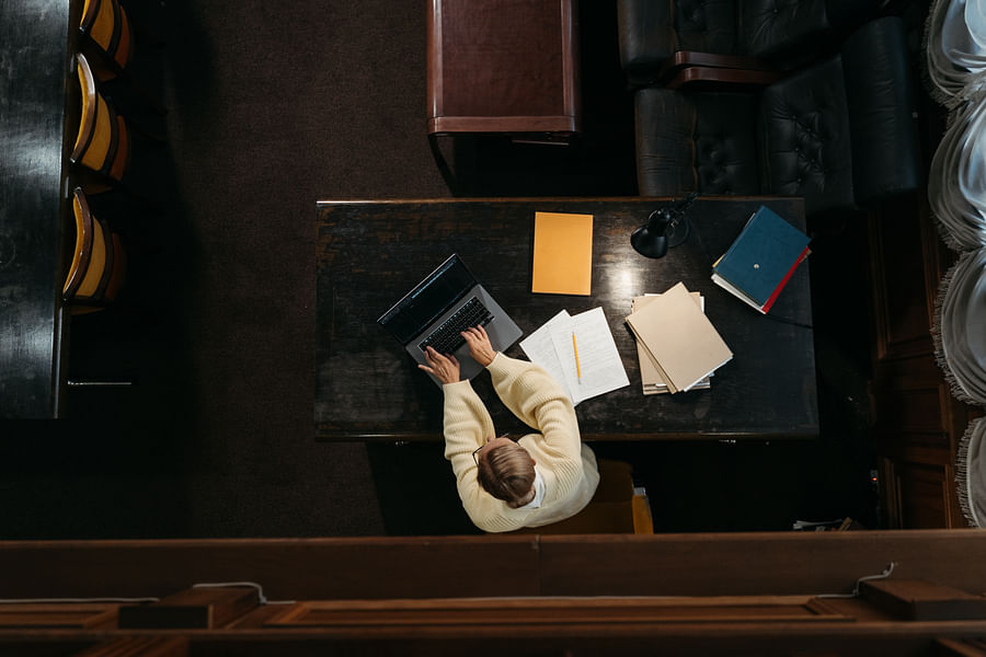 College student studying on laptop, representing the use of student loans